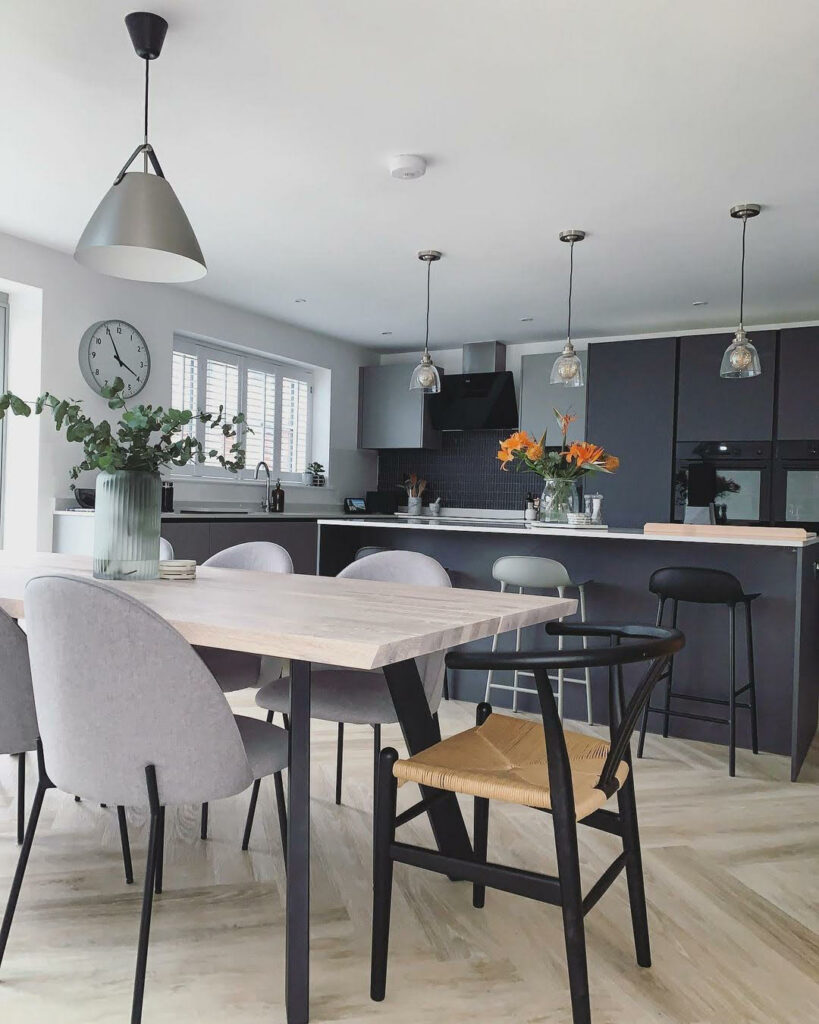 Black Wishbone Chair with Live Edge White Oiled Oak Dining Table