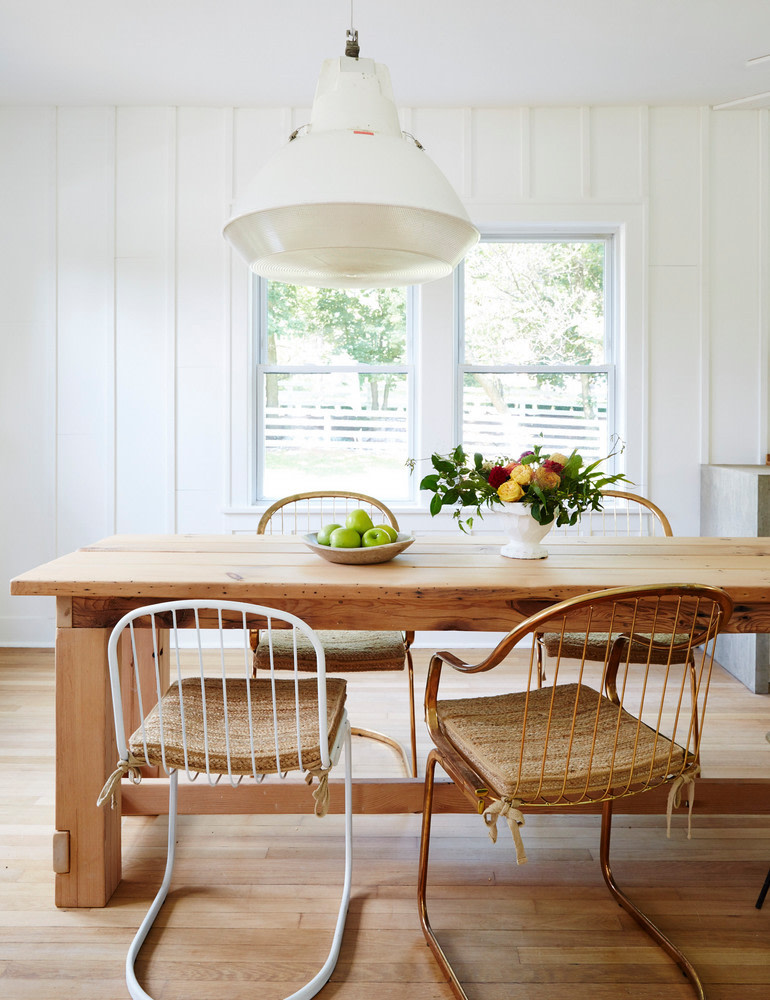 Mismatched Industrial White and Copper Chairs around Reclaimed Dining Table - Grain and Frame