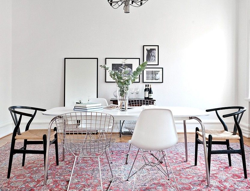 Mixed Black Wishbone and Eames Chairs around Dining Table - Grain and Frame