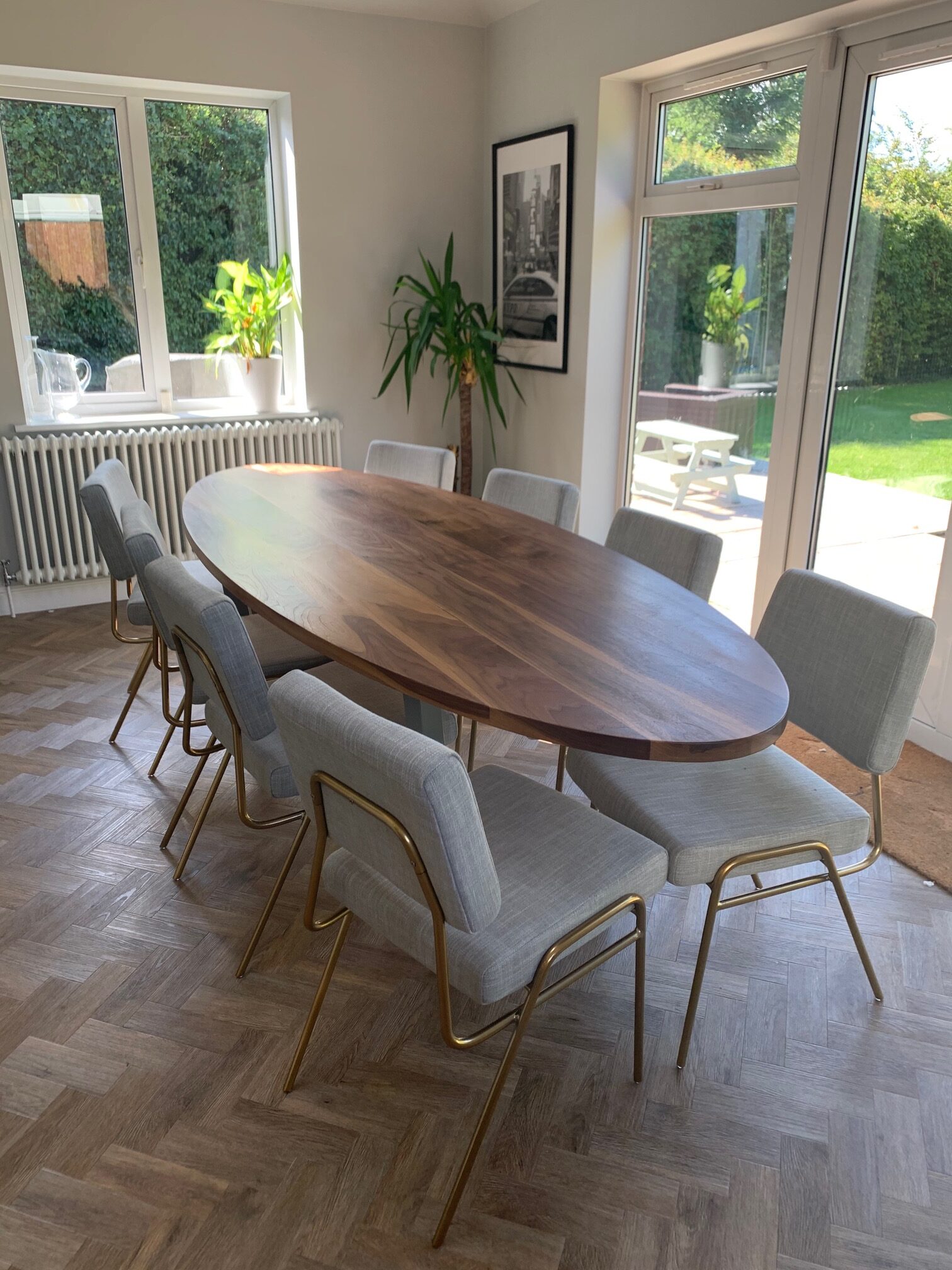 Grain and Frame Oval American Walnut Dining Table Splayed Frame