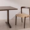 Dark solid oak Dining Table 02, with a dining chair